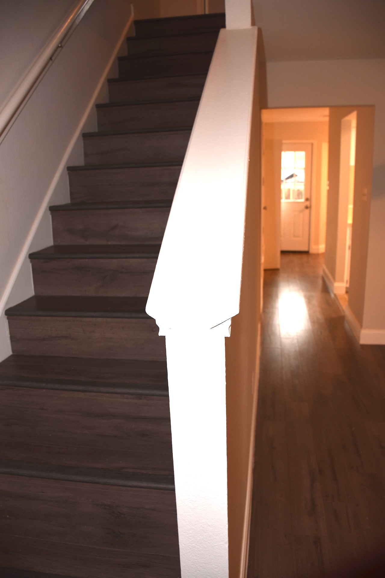 1810 Rawhide Loop Round Rock, TX 78681 - Photo 5 of 29 Staircase featuring wood-finish treads and risers with a white handrail