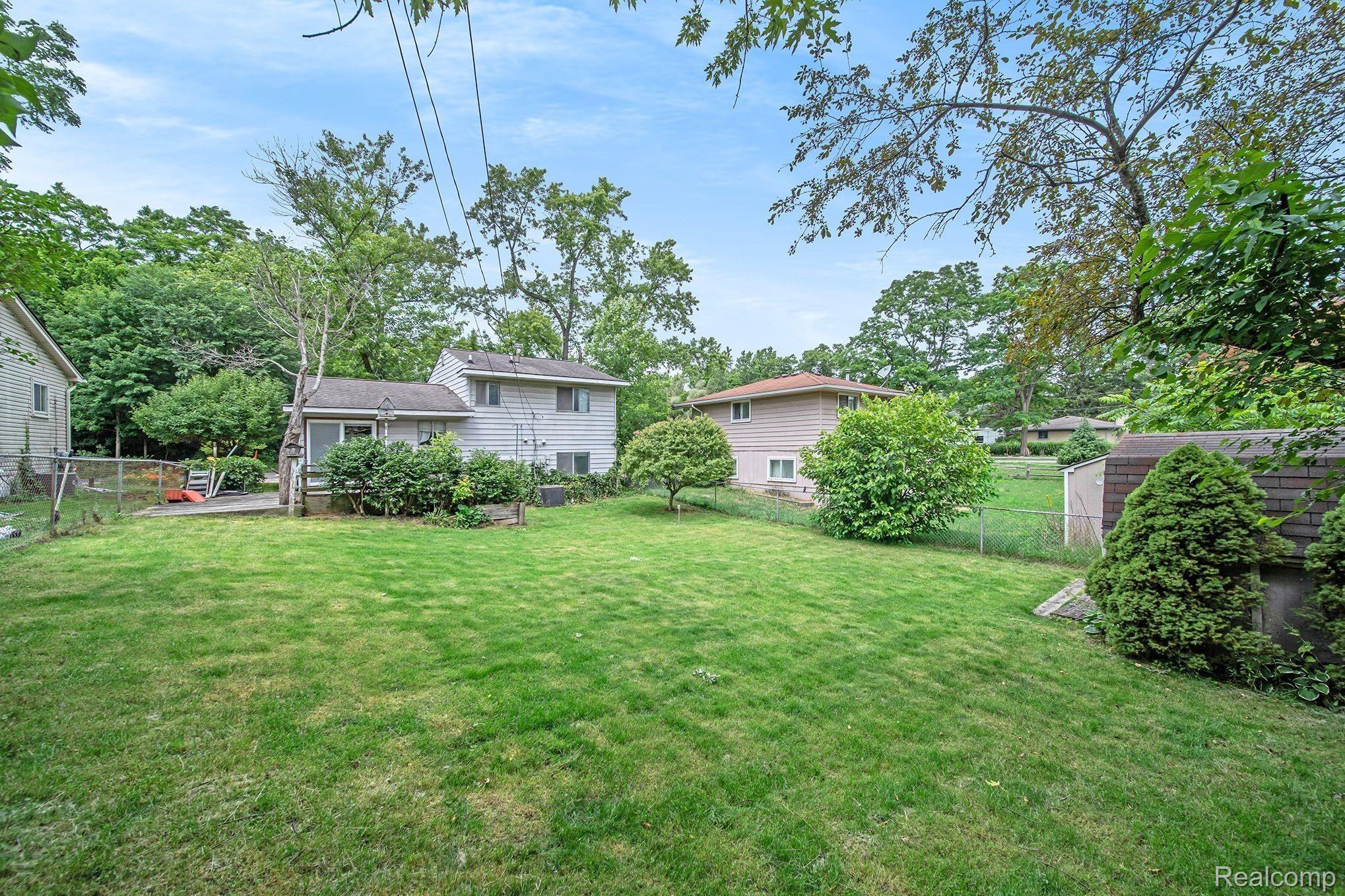 2162 Benstein Road Walled Lake, MI 48390 - Photo 14 of 14 Large fenced in back yard with Storage Shed