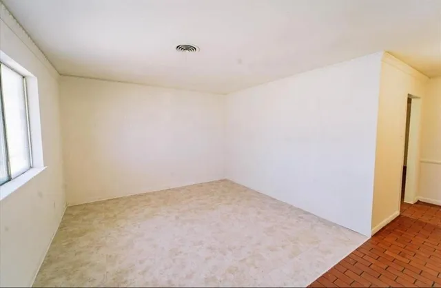 an empty room with windows