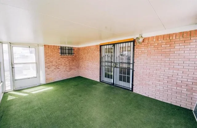 a view of an empty room with windows