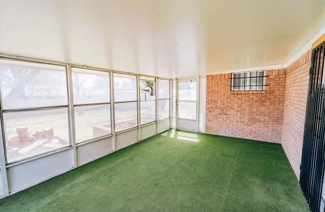 a view of an empty room with window