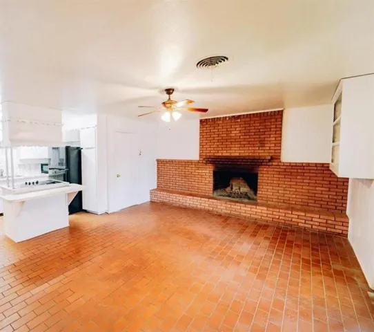 a view of a living room and kitchen with furniture
