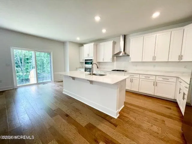 a kitchen with a sink window and cabinets