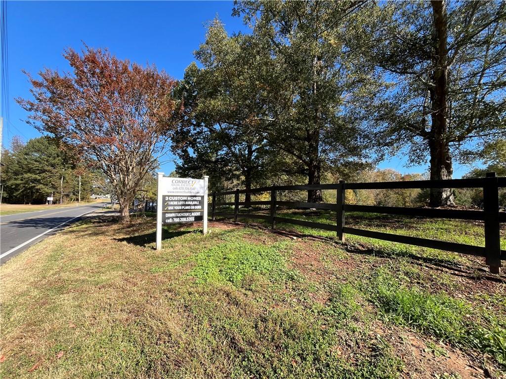 1982 Fence Road Northeast Dacula, GA 30019 - Photo 2 of 3 a view of a bench in a yard