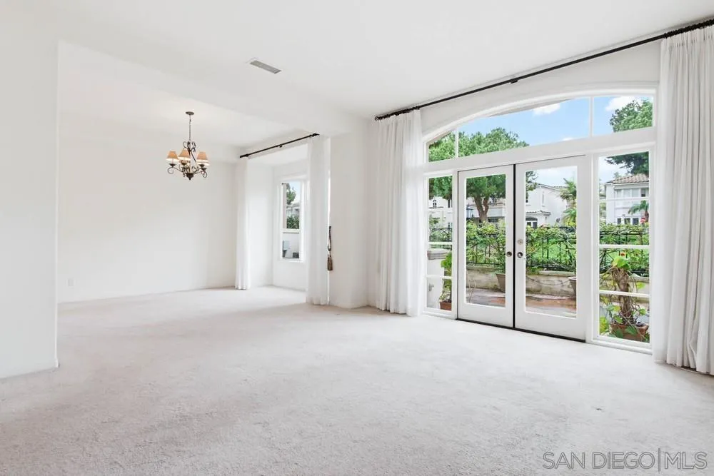 5226 Renaissance Avenue San Diego, CA 92122 - Photo 13 of 41 en empty room with windows