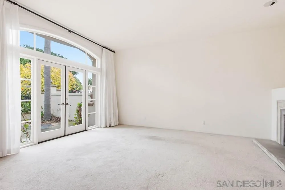 5226 Renaissance Avenue San Diego, CA 92122 - Photo 14 of 41 a view of an empty room with glass door