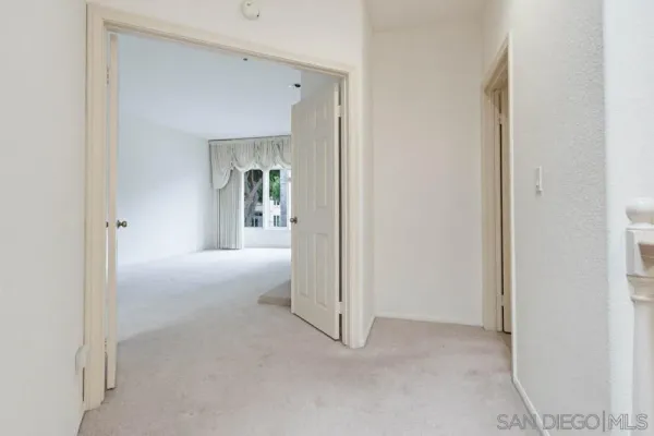 a view of a livingroom and a hallway