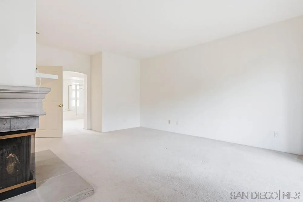 5226 Renaissance Avenue San Diego, CA 92122 - Photo 20 of 41 a view of empty room with a fireplace