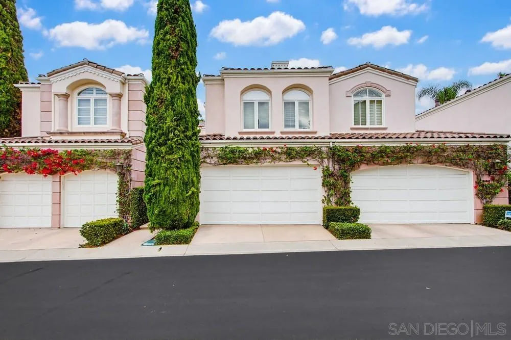 5226 Renaissance Avenue San Diego, CA 92122 - Photo 2 of 41 a front view of a house with a yard and garage