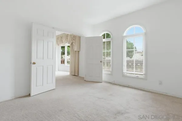 an empty room with windows