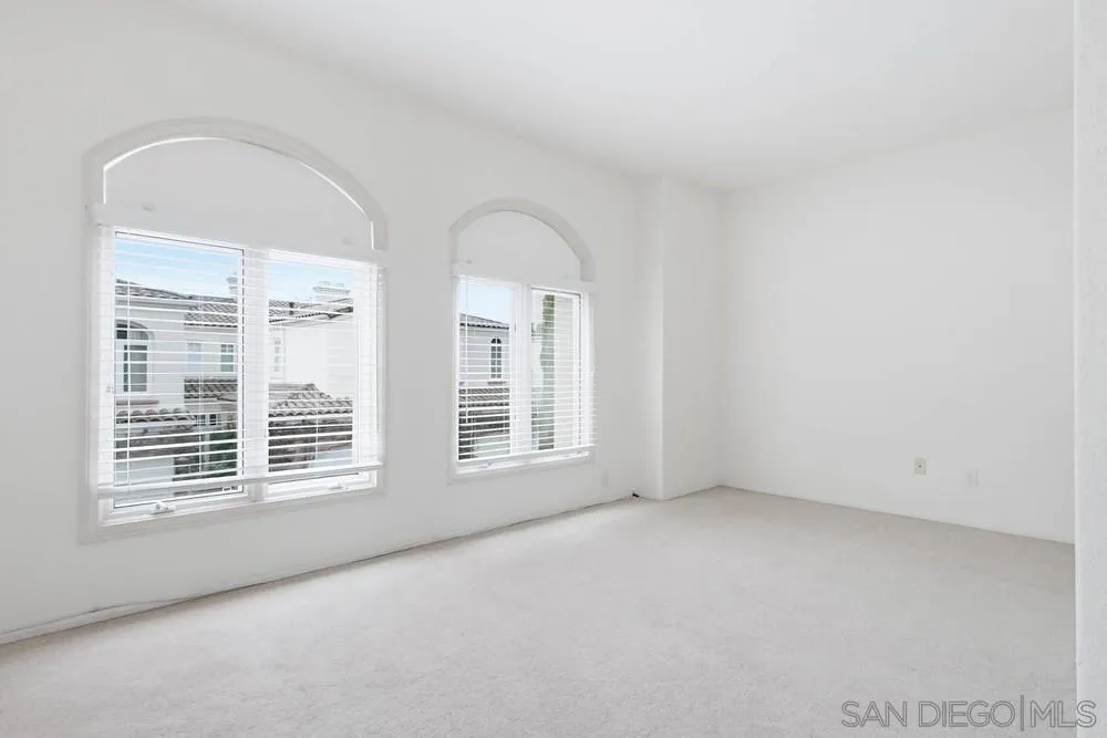 5226 Renaissance Avenue San Diego, CA 92122 - Photo 35 of 41 an empty room with windows