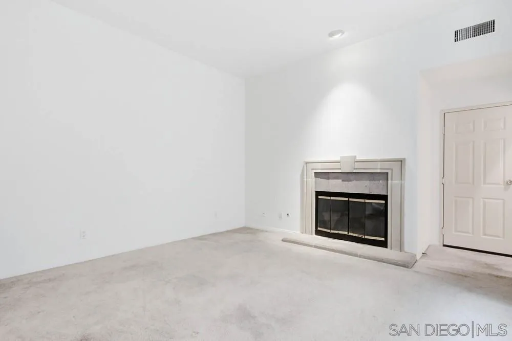 5226 Renaissance Avenue San Diego, CA 92122 - Photo 6 of 41 a view of empty room with a fireplace