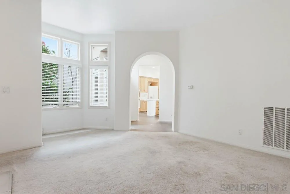 5226 Renaissance Avenue San Diego, CA 92122 - Photo 7 of 41 an empty room with windows