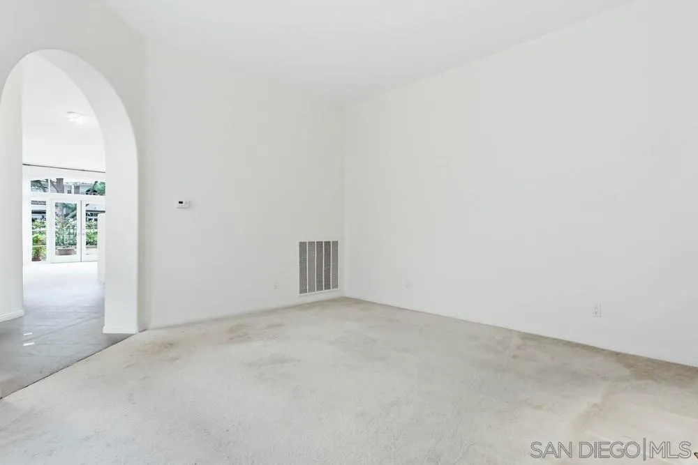 5226 Renaissance Avenue San Diego, CA 92122 - Photo 8 of 41 an empty room with windows
