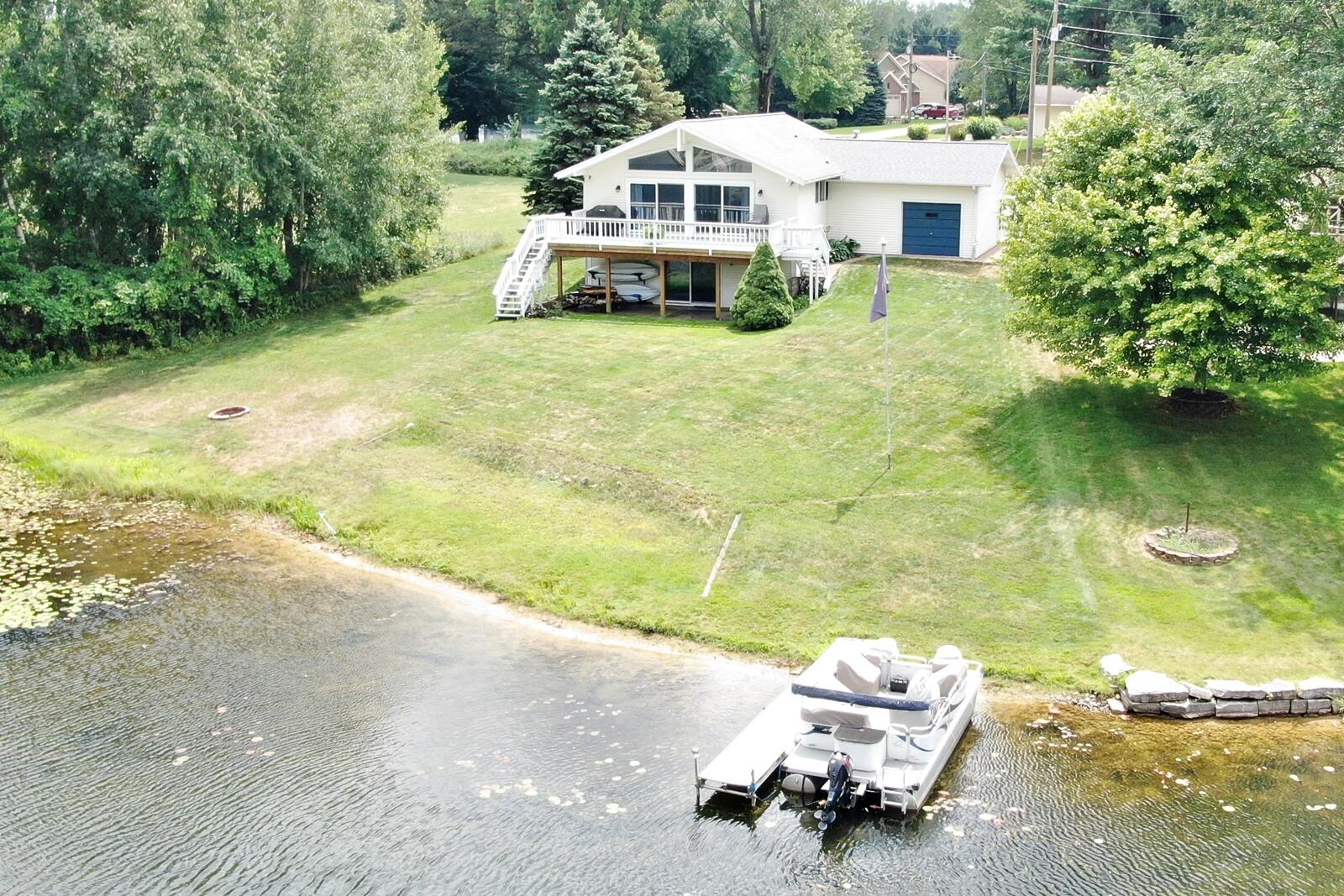 11430 North Lookout Ridge Canadian Lakes, MI 49346 - Photo 2 of 24 2 Walkout waterfront