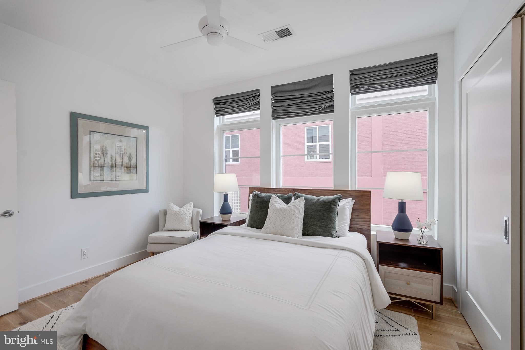 2419 Ontario Road Northwest, Unit 202 Washington, DC 20009 - Photo 11 of 15 a bedroom with a bed and a window