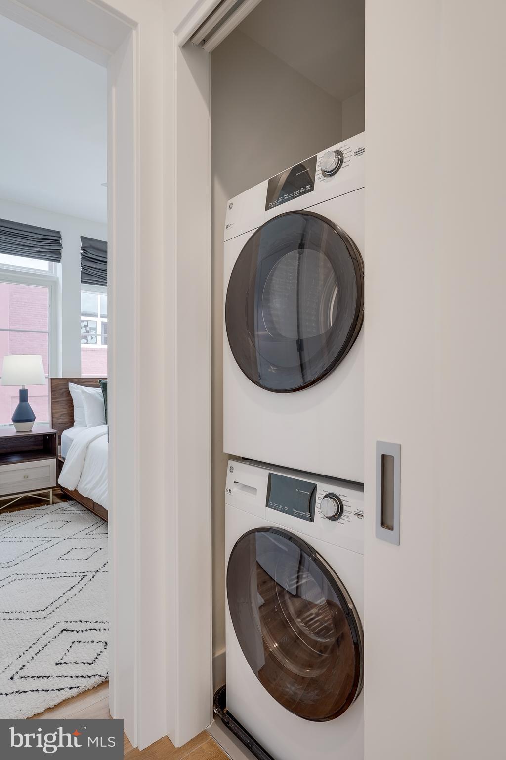 2419 Ontario Road Northwest, Unit 202 Washington, DC 20009 - Photo 13 of 15 a utility room with dryer and washer