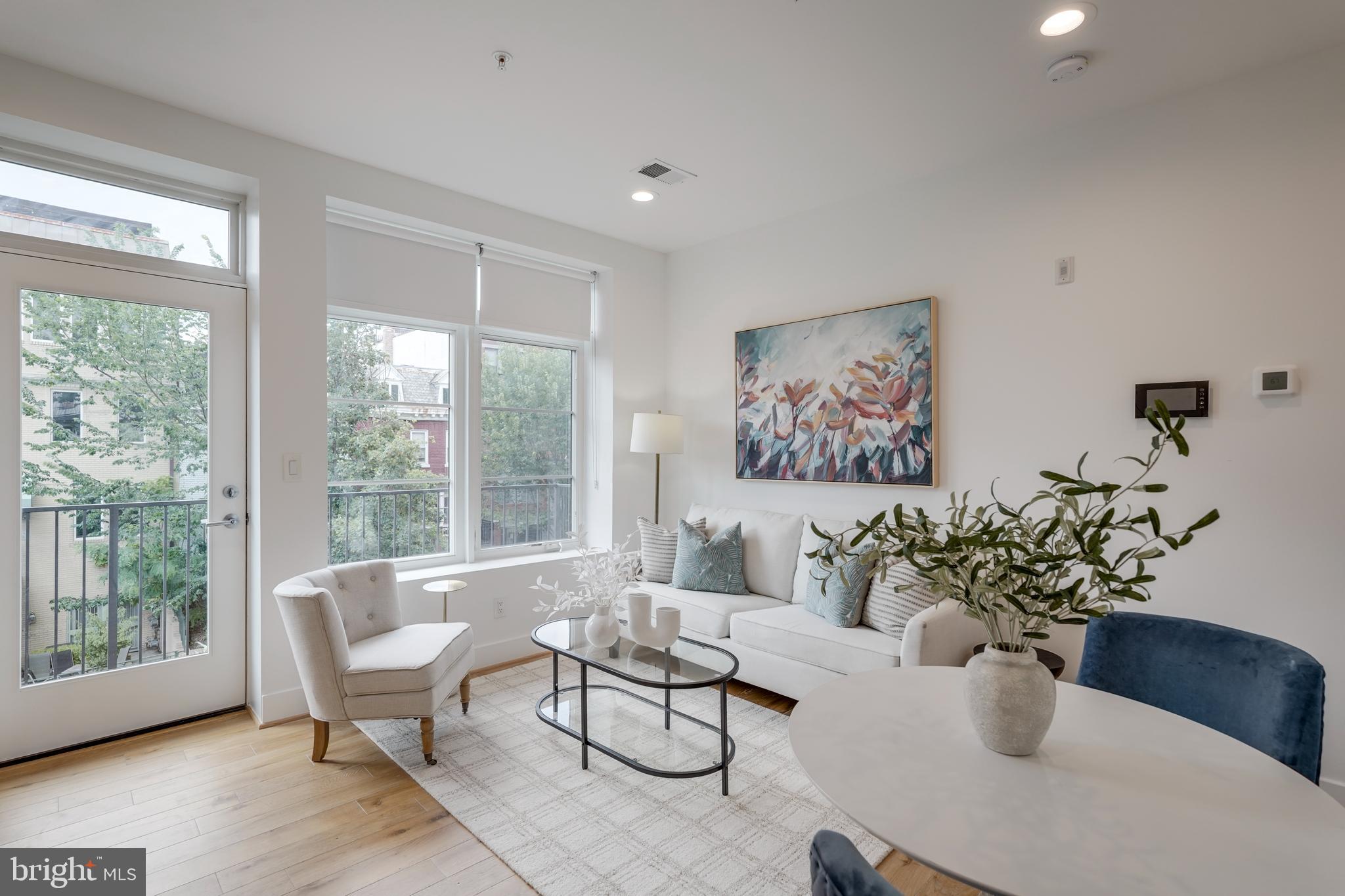 2419 Ontario Road Northwest, Unit 202 Washington, DC 20009 - Photo 2 of 15 a living room with furniture and window