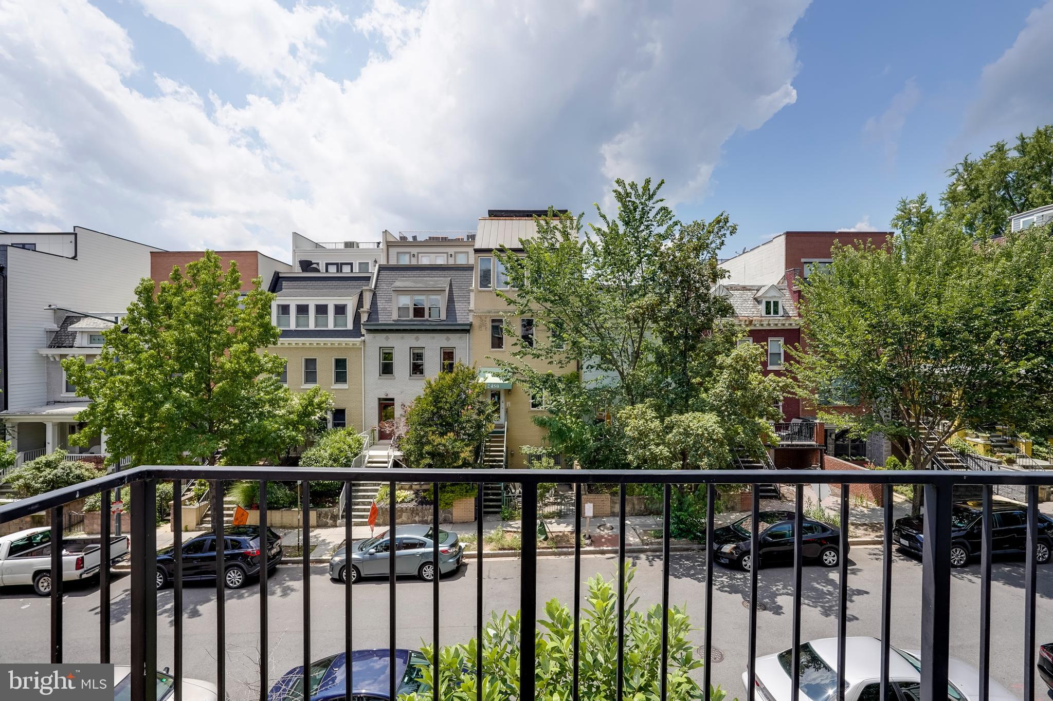 2419 Ontario Road Northwest, Unit 202 Washington, DC 20009 - Photo 8 of 15 a view of a balcony with wooden fence and floor