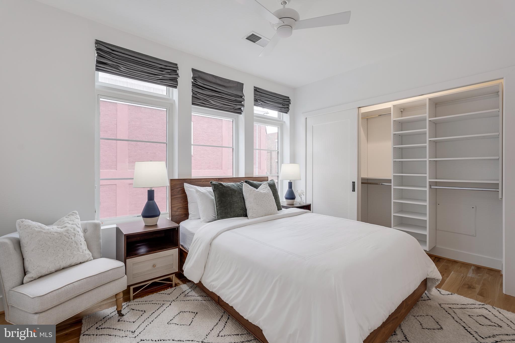 2419 Ontario Road Northwest, Unit 202 Washington, DC 20009 - Photo 9 of 15 a bedroom with a bed and a window