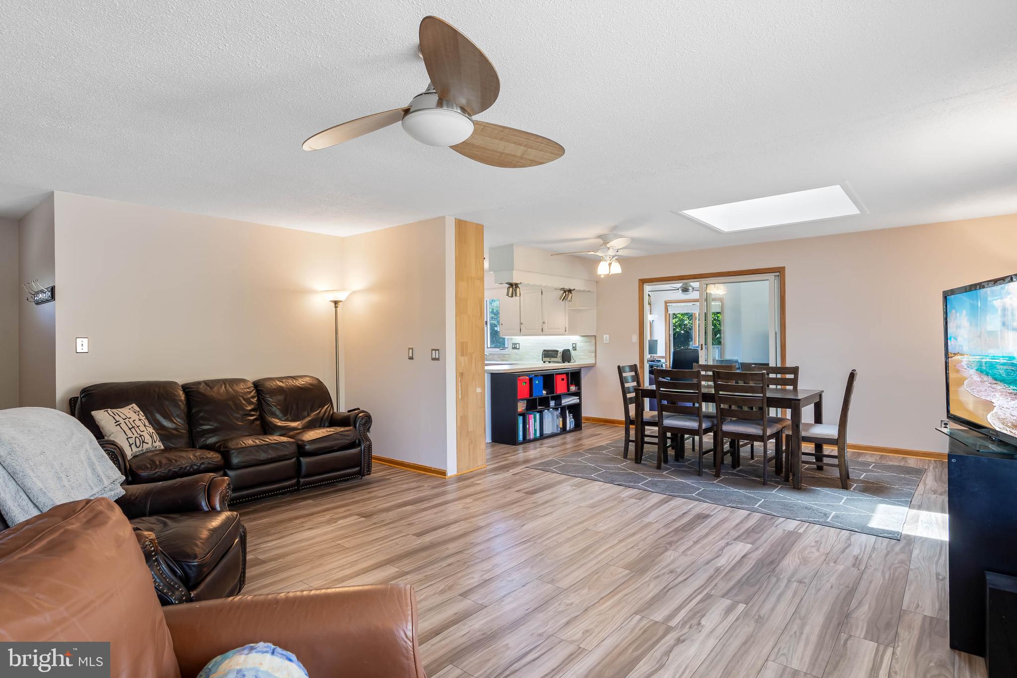 521 Harbor Road Ocean View, DE 19970 - Photo 11 of 46 a living room with furniture and wooden floor