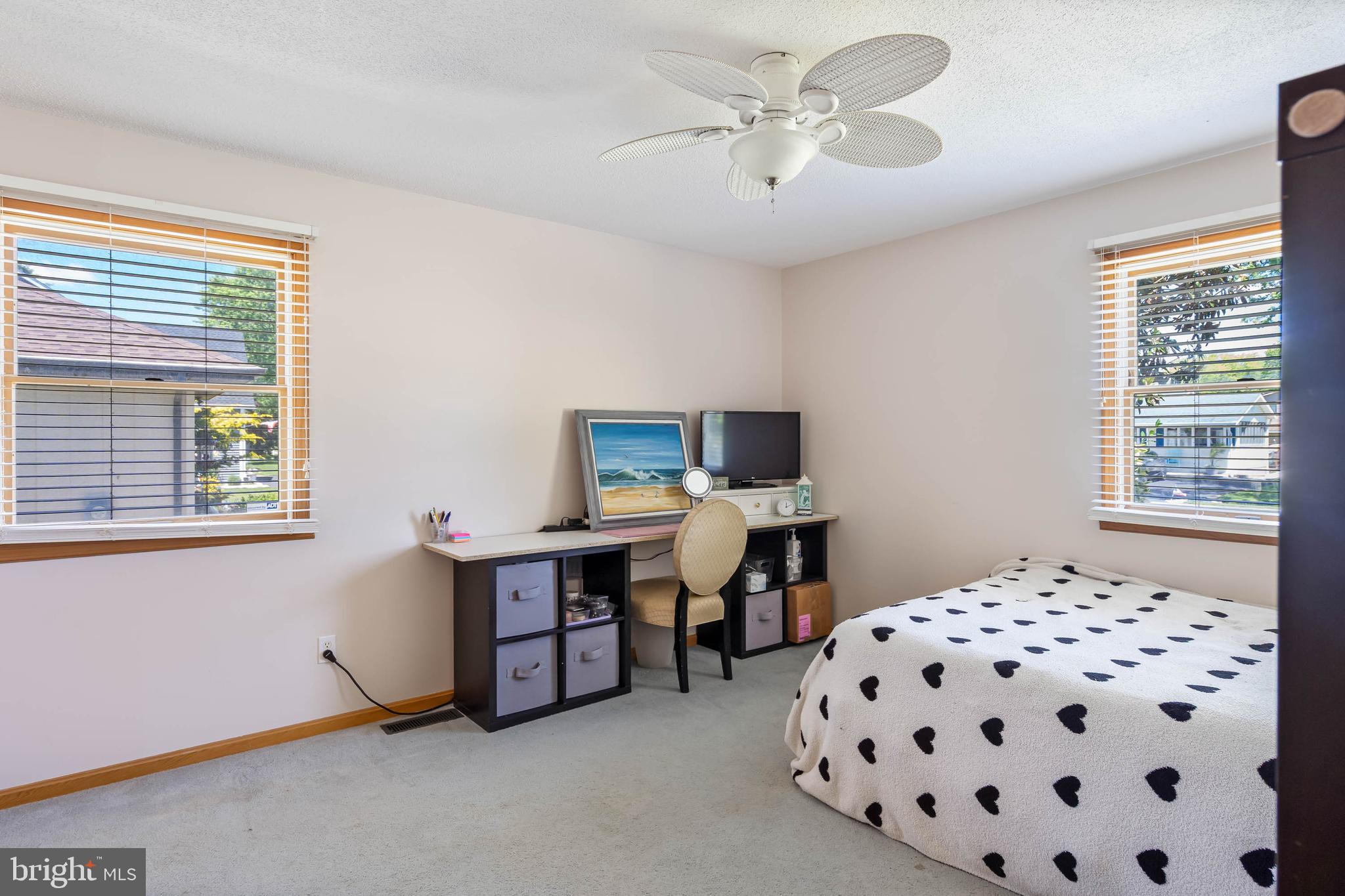521 Harbor Road Ocean View, DE 19970 - Photo 15 of 46 a bedroom with furniture and window