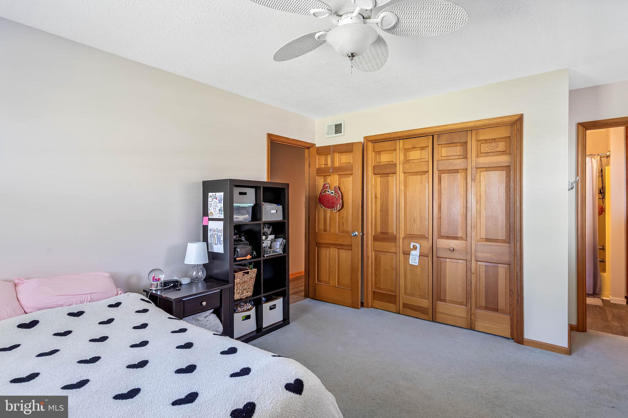 521 Harbor Road Ocean View, DE 19970 - Photo 16 of 46 a view of a bedroom with workspace and wooden floor