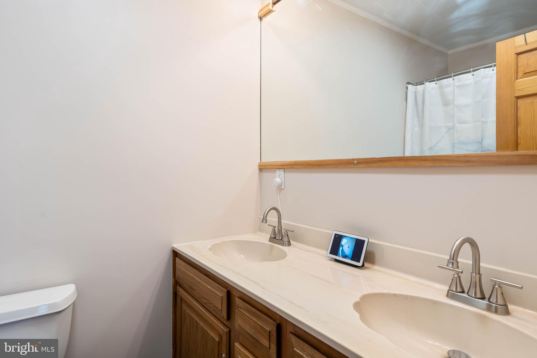521 Harbor Road Ocean View, DE 19970 - Photo 22 of 46 a bathroom with a sink and a toilet
