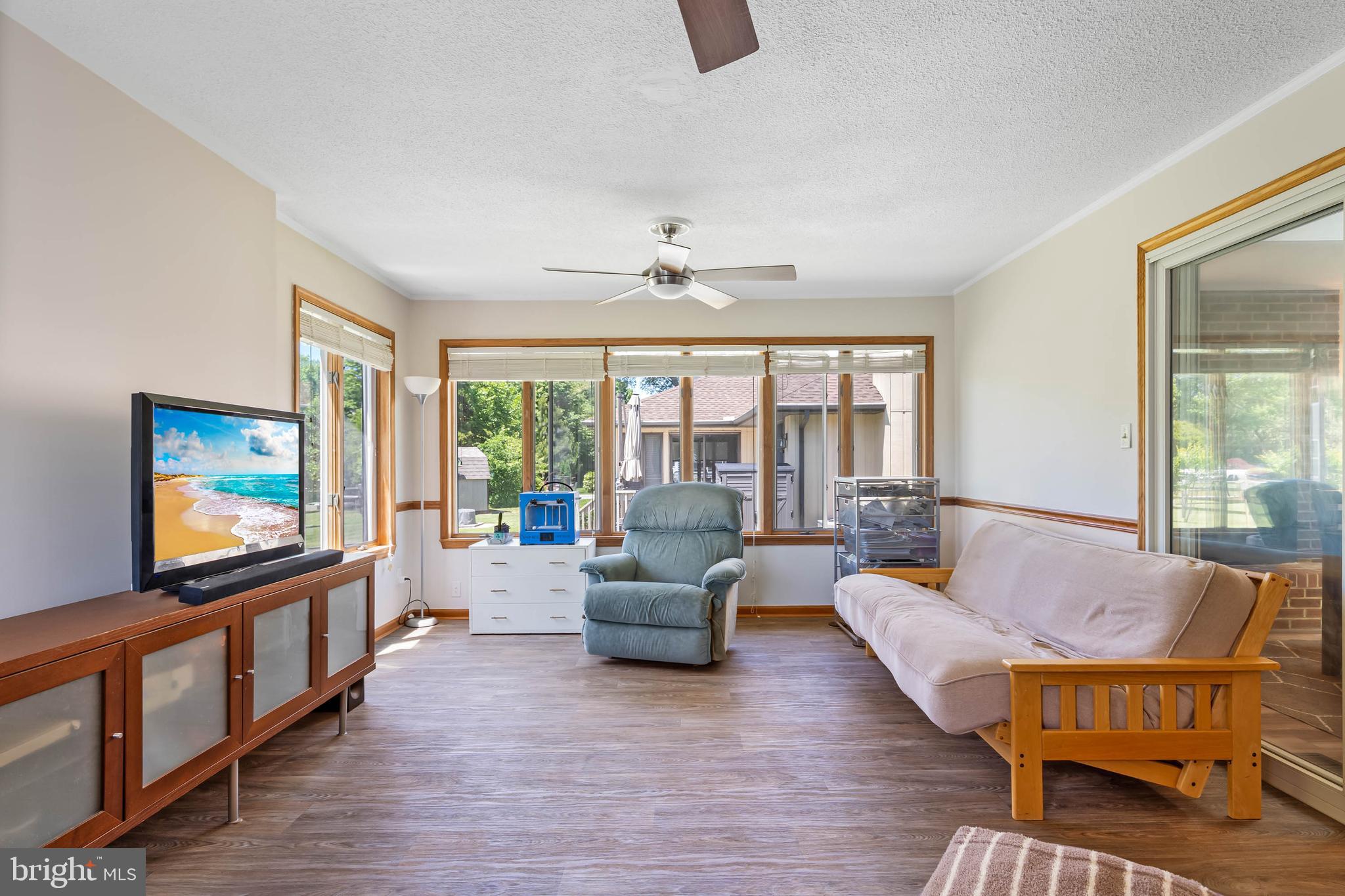 521 Harbor Road Ocean View, DE 19970 - Photo 24 of 46 a living room with furniture and a flat screen tv