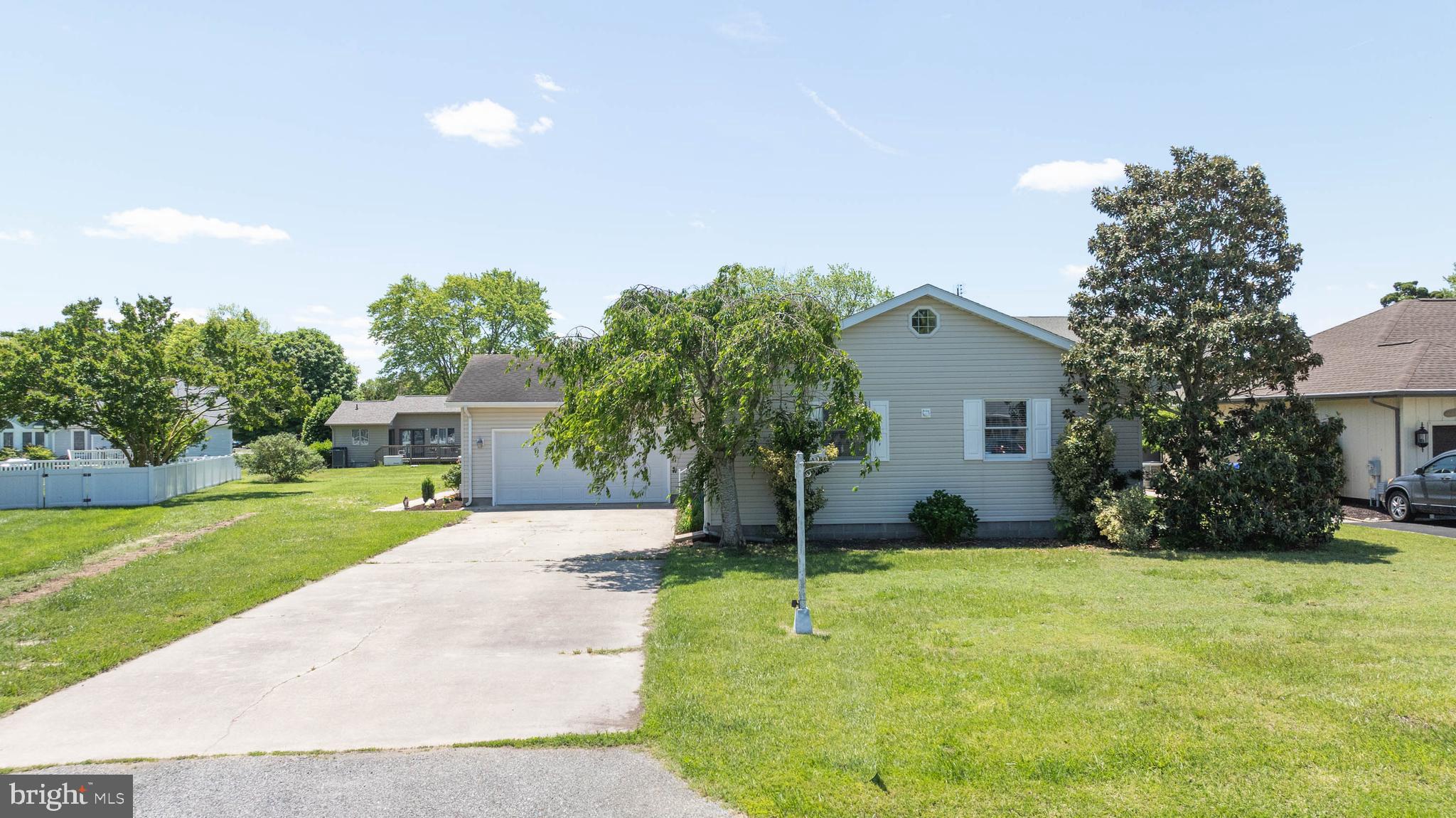 521 Harbor Road Ocean View, DE 19970 - Photo 27 of 46 a front view of house with yard and green space