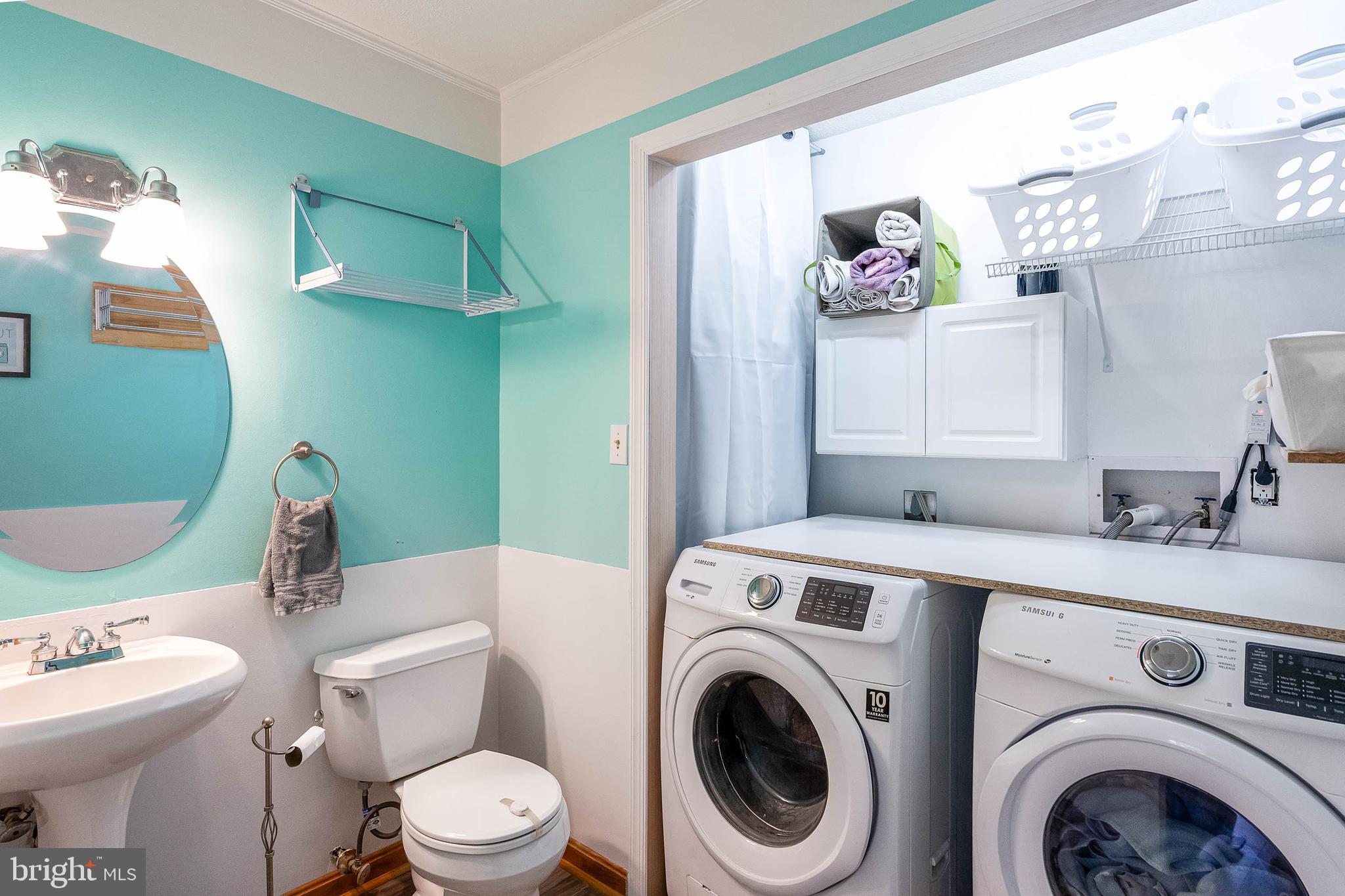 521 Harbor Road Ocean View, DE 19970 - Photo 7 of 46 a bathroom with a toilet sink and mirror