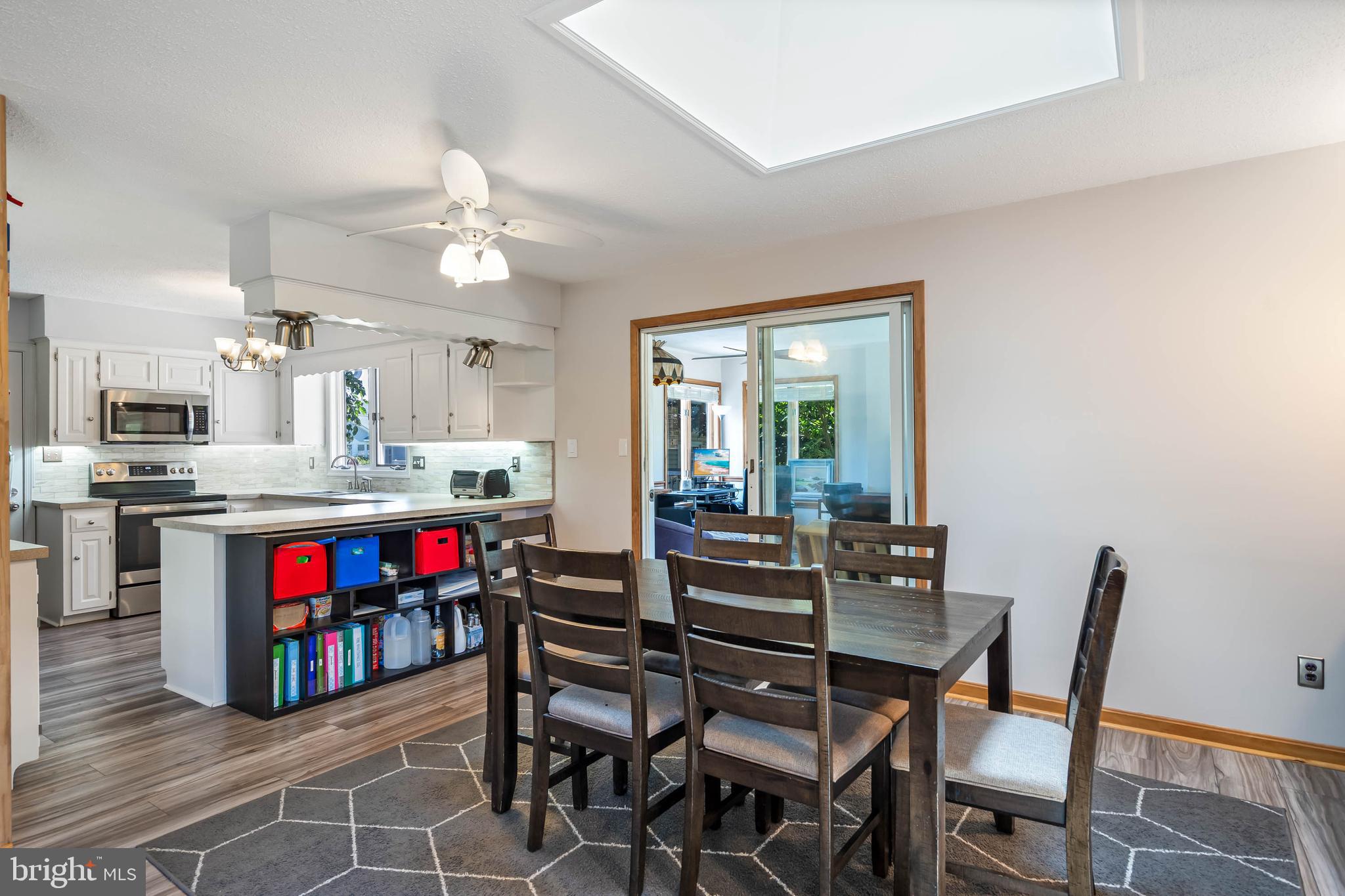 521 Harbor Road Ocean View, DE 19970 - Photo 9 of 46 a view of a dining room with furniture and a view of kitchen