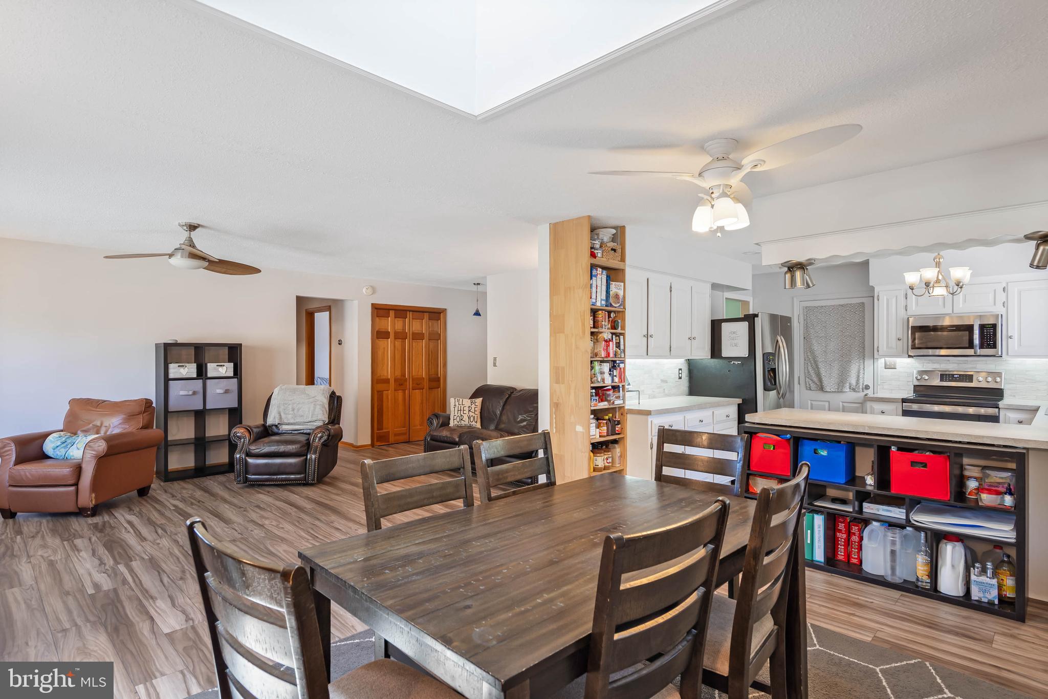 521 Harbor Road Ocean View, DE 19970 - Photo 10 of 46 a living room with furniture kitchen view and a large window