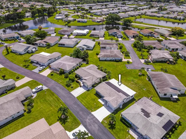 an aerial view of residential houses with outdoor space