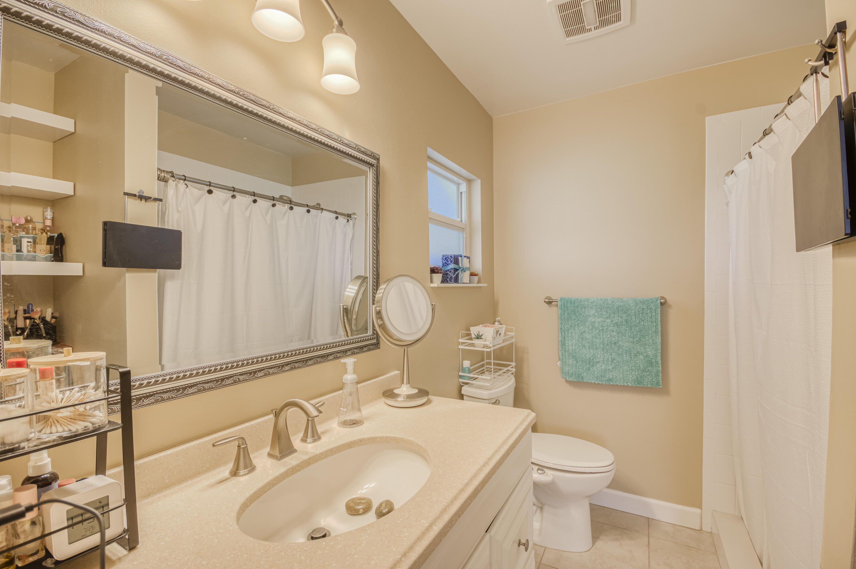 5398 Belleville Road West Palm Beach, FL 33417 - Photo 14 of 25 a bathroom with a sink toilet and shower