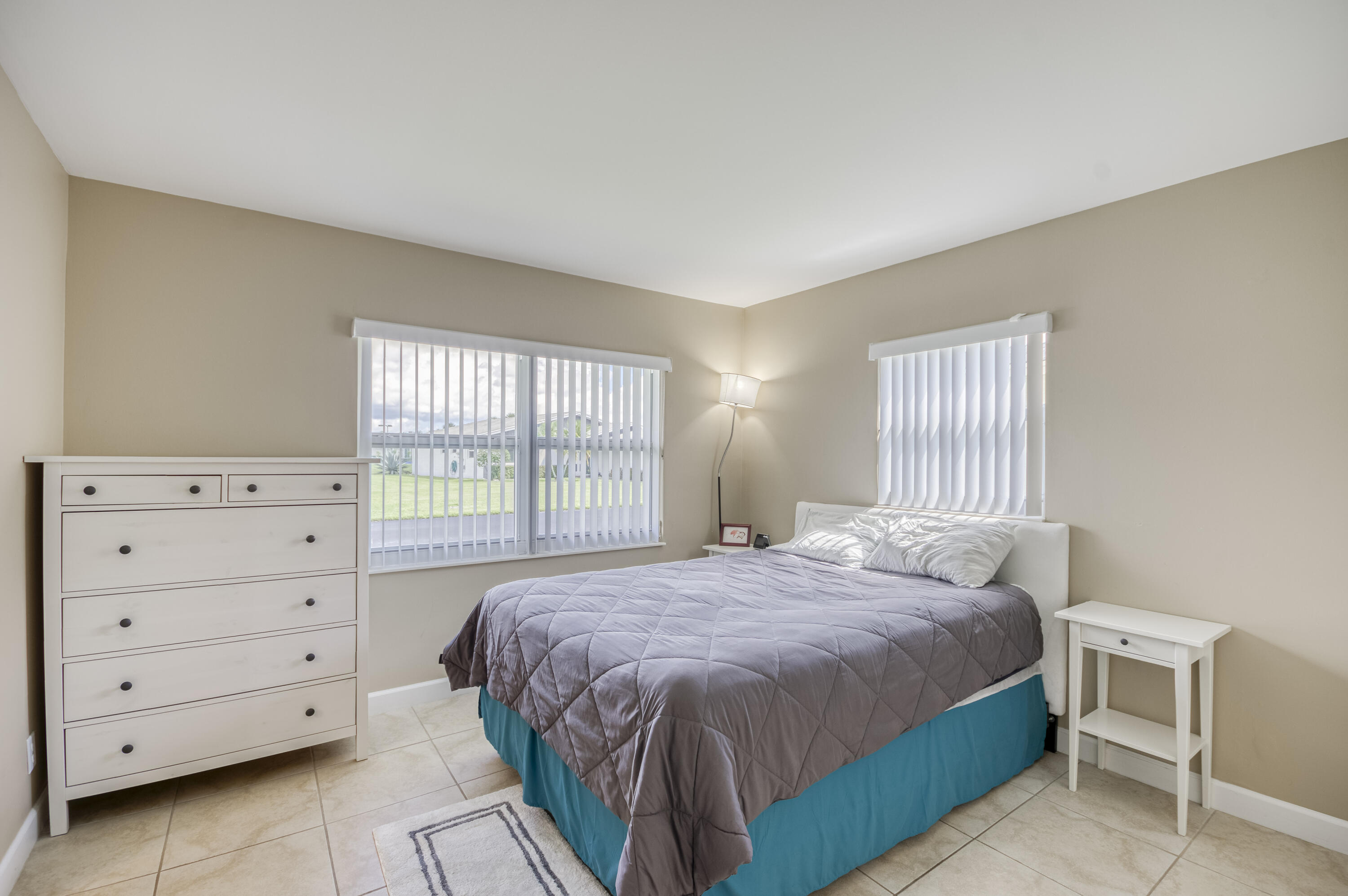 5398 Belleville Road West Palm Beach, FL 33417 - Photo 15 of 25 a bedroom with a bed and a window