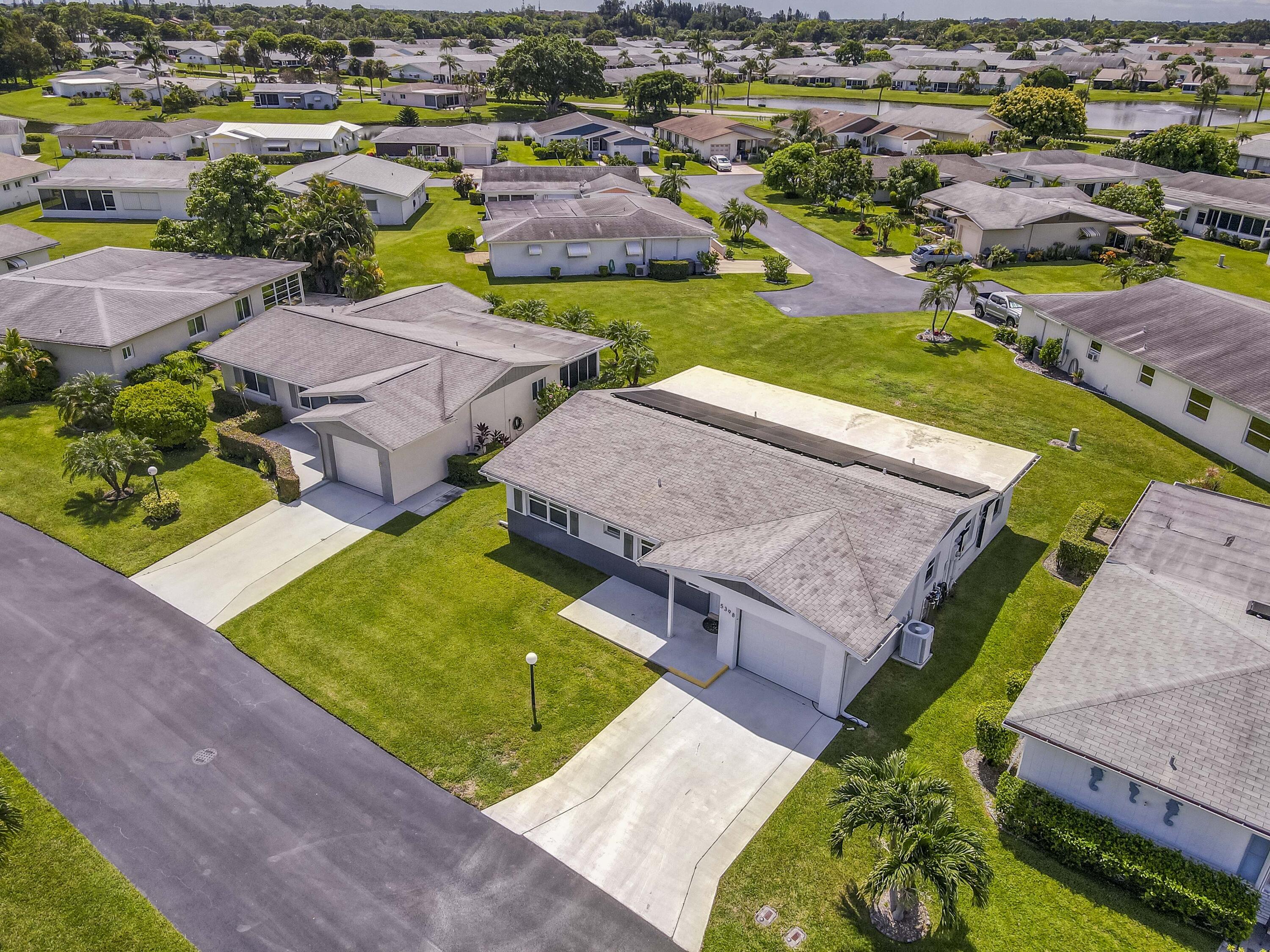 5398 Belleville Road West Palm Beach, FL 33417 - Photo 22 of 25 an aerial view of a house with a swimming pool yard and outdoor seating