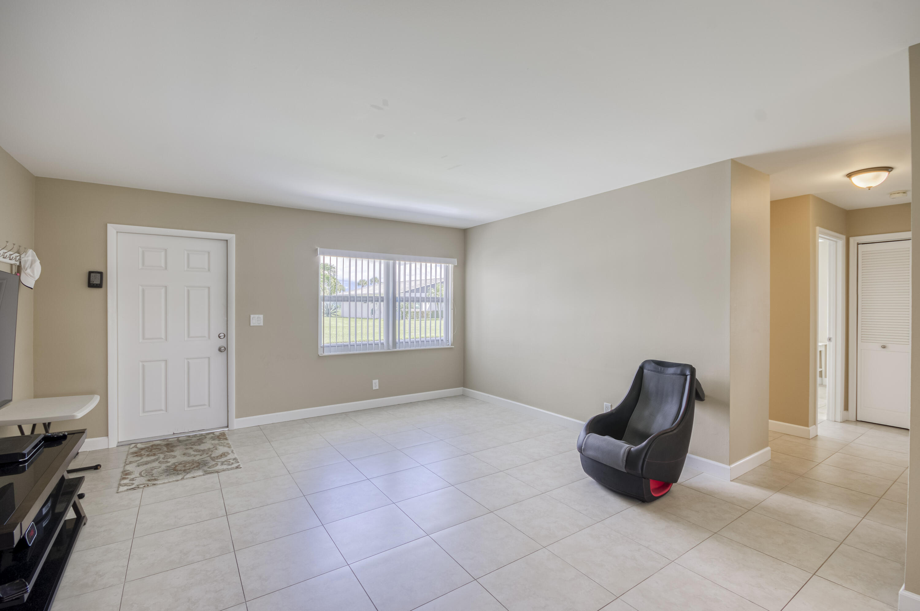 5398 Belleville Road West Palm Beach, FL 33417 - Photo 5 of 25 a view of an empty room and window