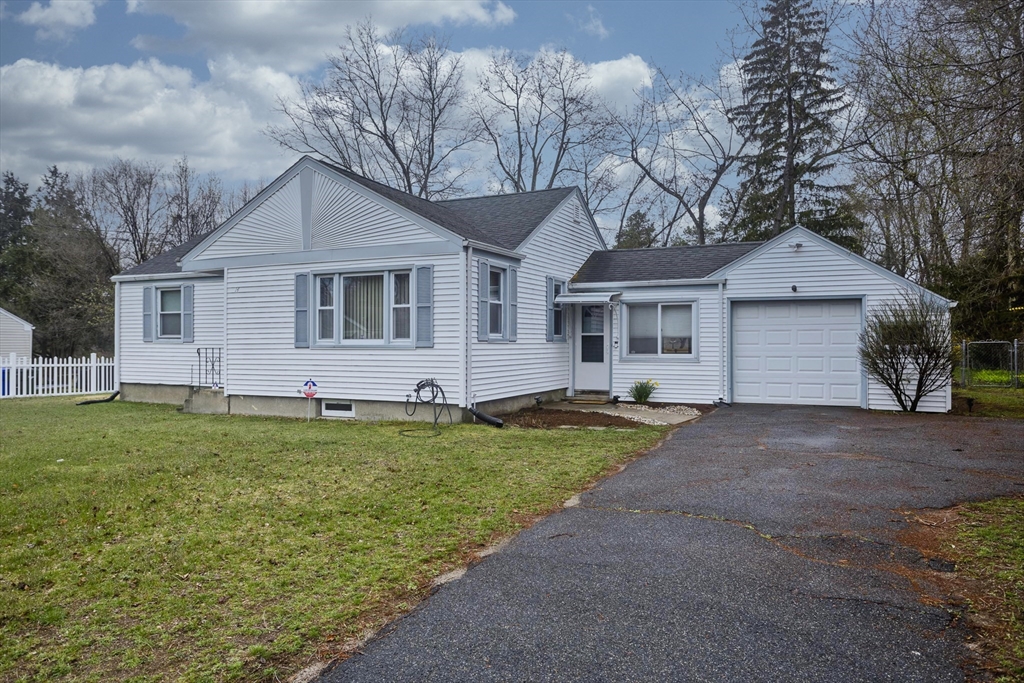 14 Tumbleweed Road Springfield, MA 01109 - Photo 1 of 28 a front view of a house with a yard and garage