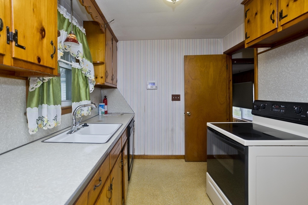 14 Tumbleweed Road Springfield, MA 01109 - Photo 11 of 28 a kitchen that has a sink and a stove