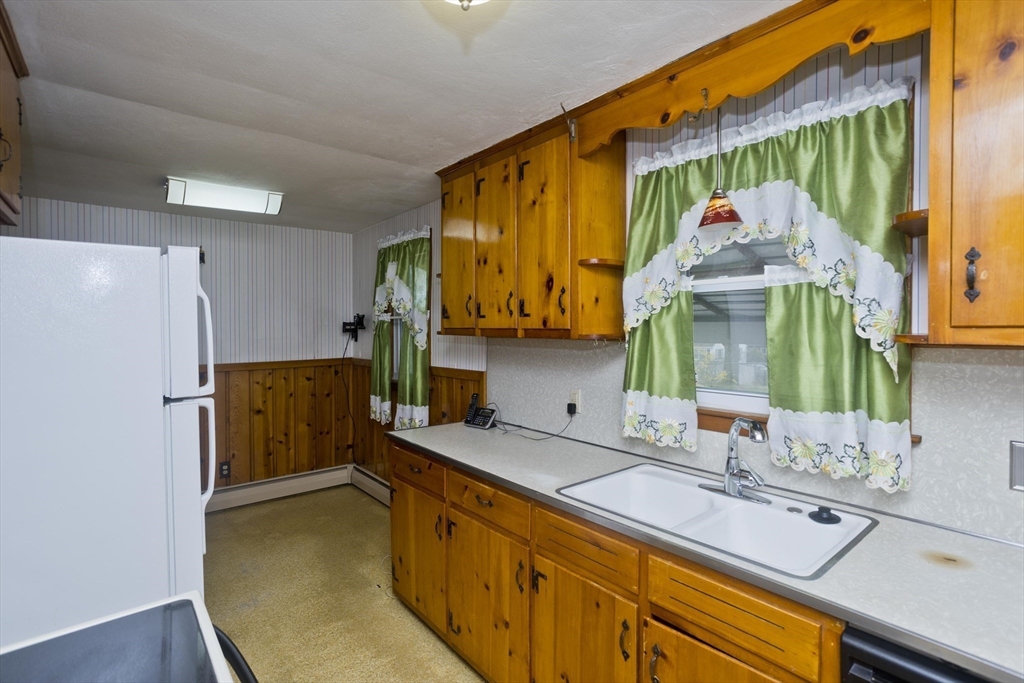 14 Tumbleweed Road Springfield, MA 01109 - Photo 12 of 28 a kitchen with a refrigerator and a sink