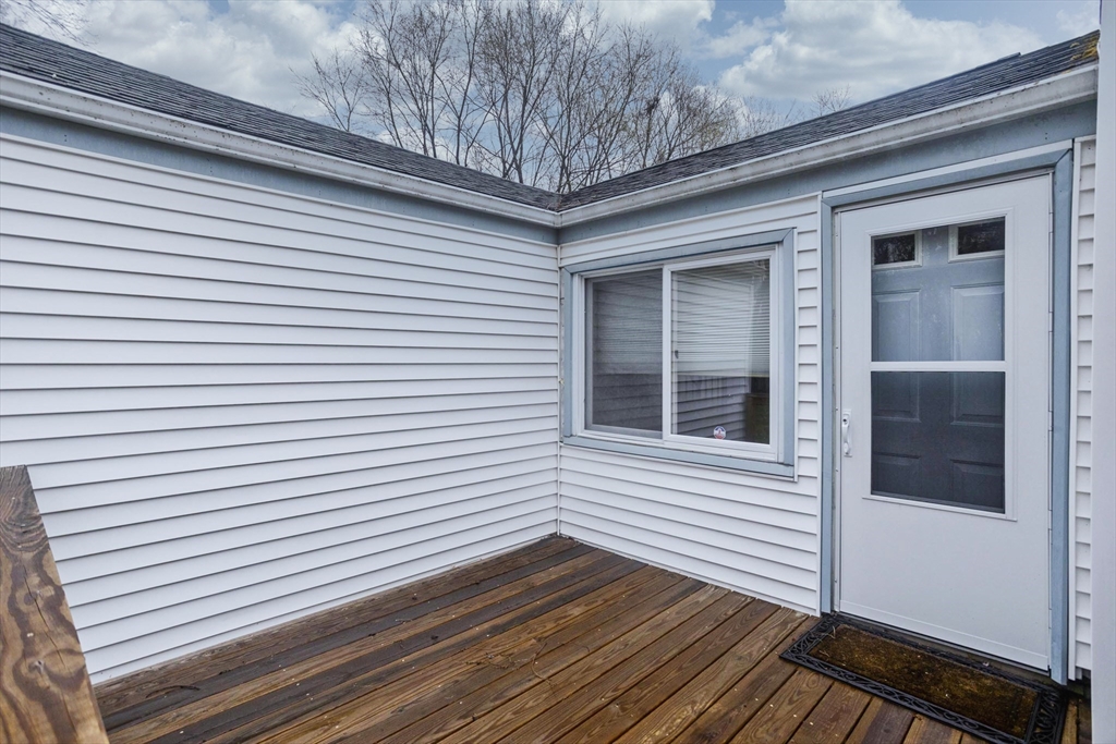 14 Tumbleweed Road Springfield, MA 01109 - Photo 6 of 28 a view of a porch with wooden floor