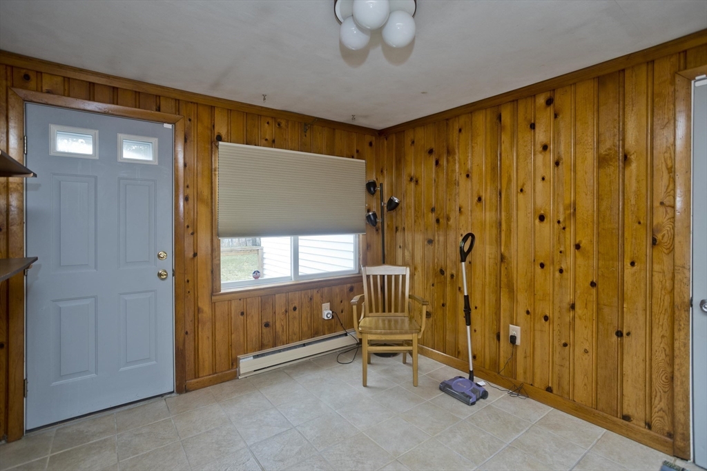 14 Tumbleweed Road Springfield, MA 01109 - Photo 9 of 28 a view of an empty room with a birdcage and a window