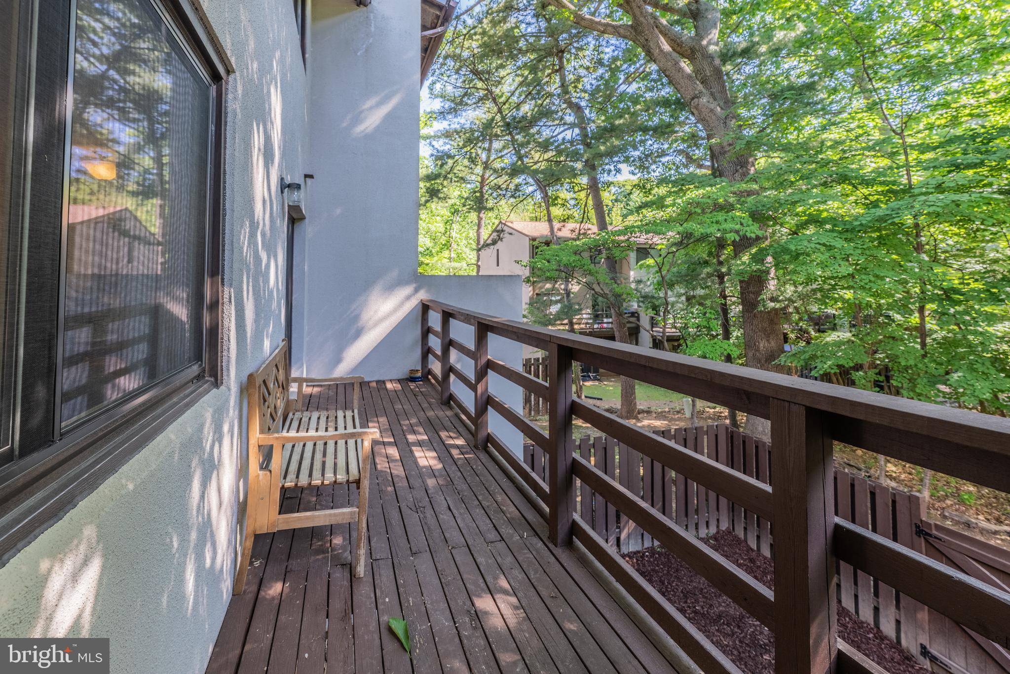 11917 Barrel Cooper Court Reston, VA 20191 - Photo 18 of 59 a view of balcony with wooden floor and fence