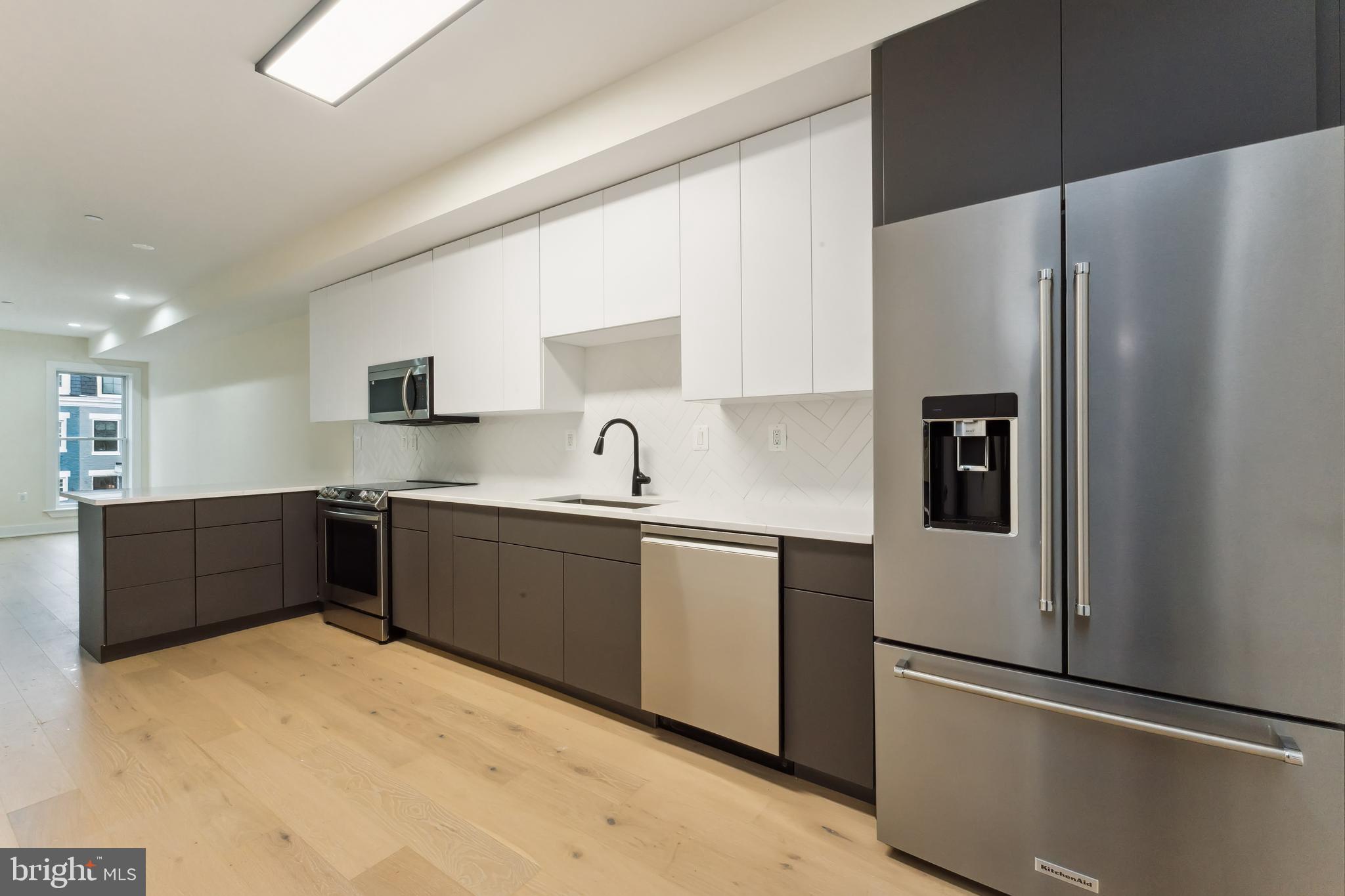 329 16th Street Southeast Washington, DC 20003 - Photo 13 of 39 a kitchen with stainless steel appliances a refrigerator and a sink