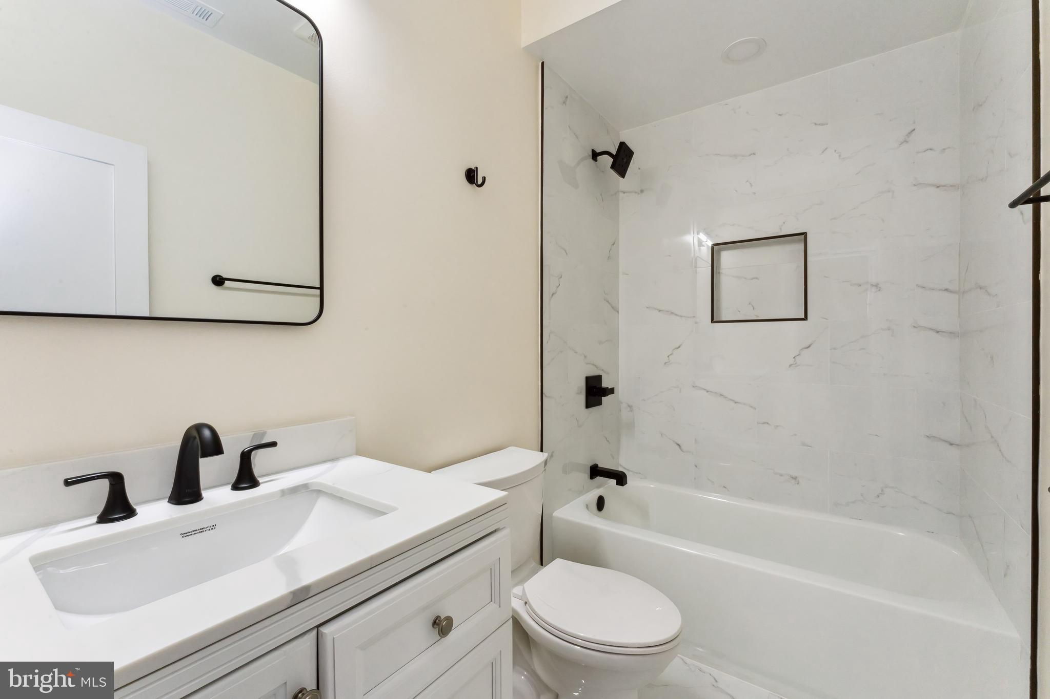 329 16th Street Southeast Washington, DC 20003 - Photo 15 of 39 a bathroom with a sink a toilet and bathtub