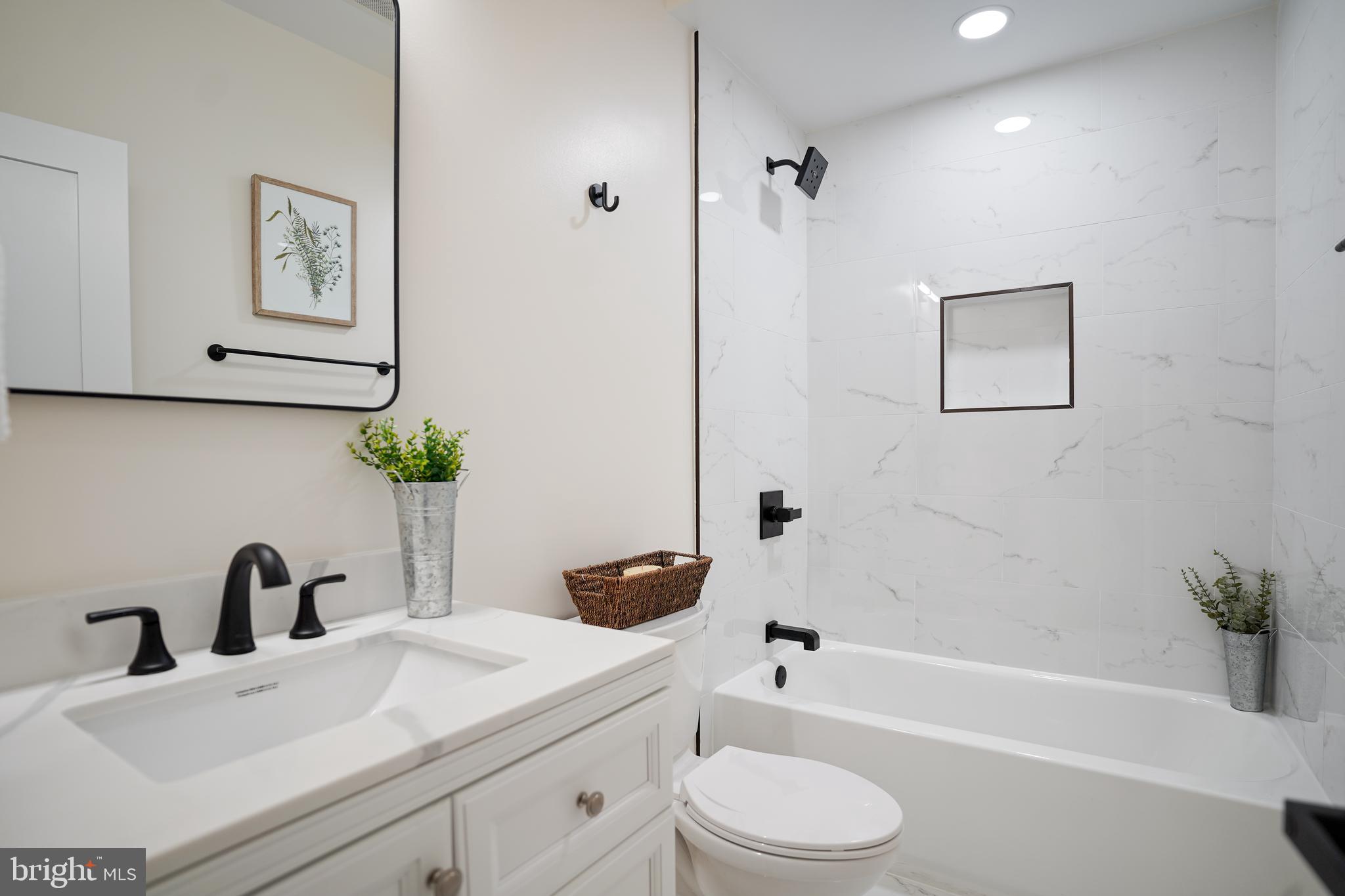 329 16th Street Southeast Washington, DC 20003 - Photo 20 of 39 a bathroom with a sink a toilet and bathtub