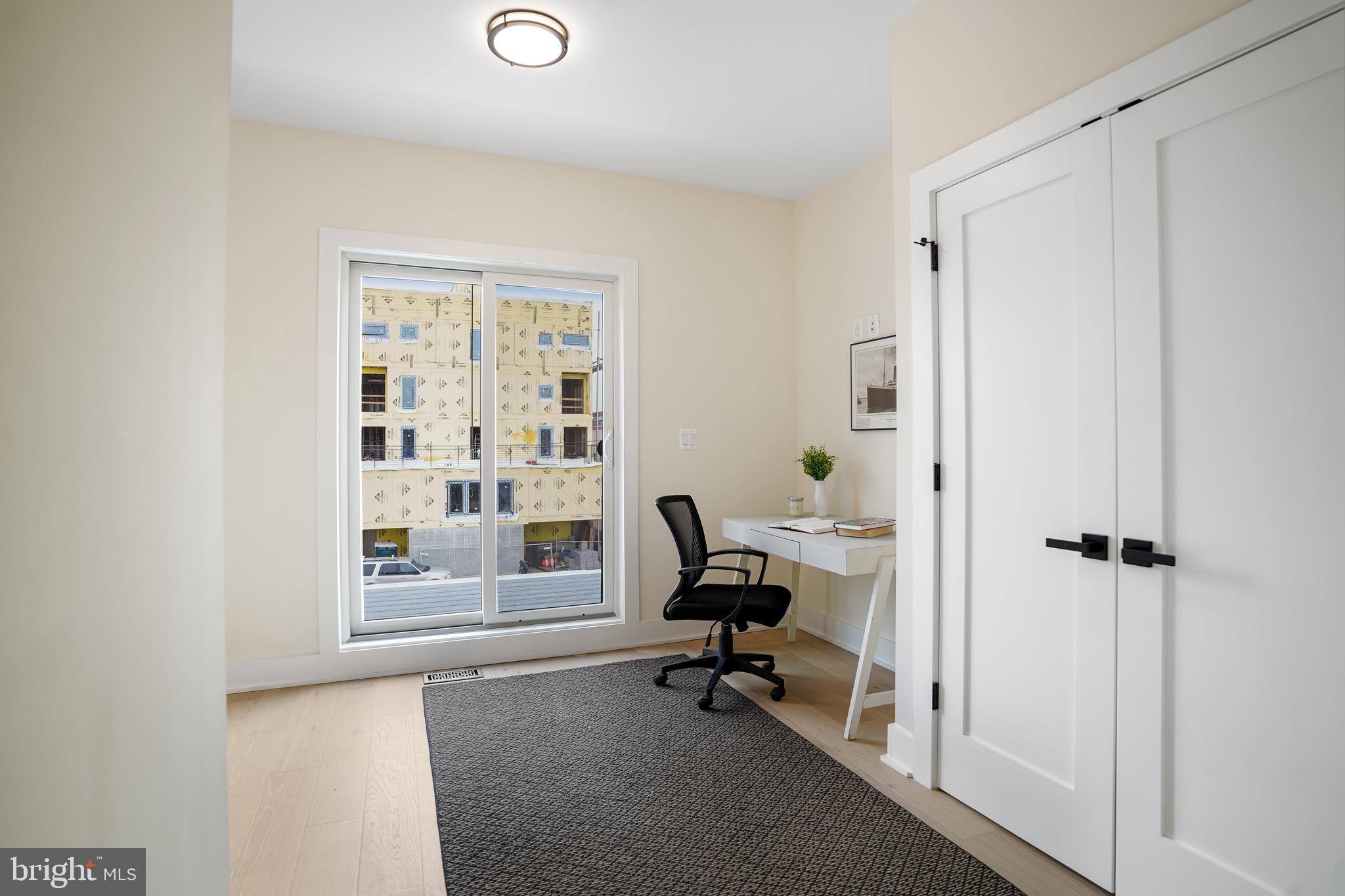 329 16th Street Southeast Washington, DC 20003 - Photo 24 of 39 a view of a workspace with furniture and a window