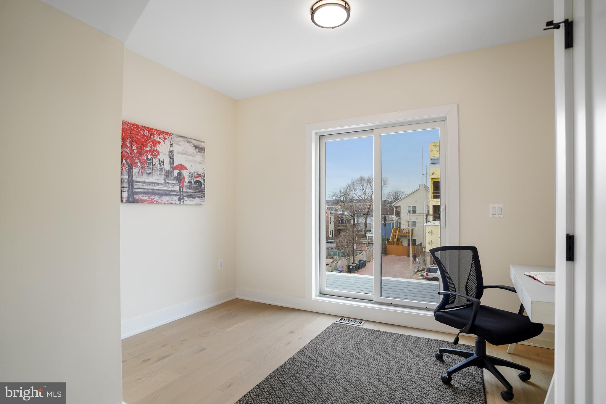 329 16th Street Southeast Washington, DC 20003 - Photo 25 of 39 a view of workspace with wooden floor and windows