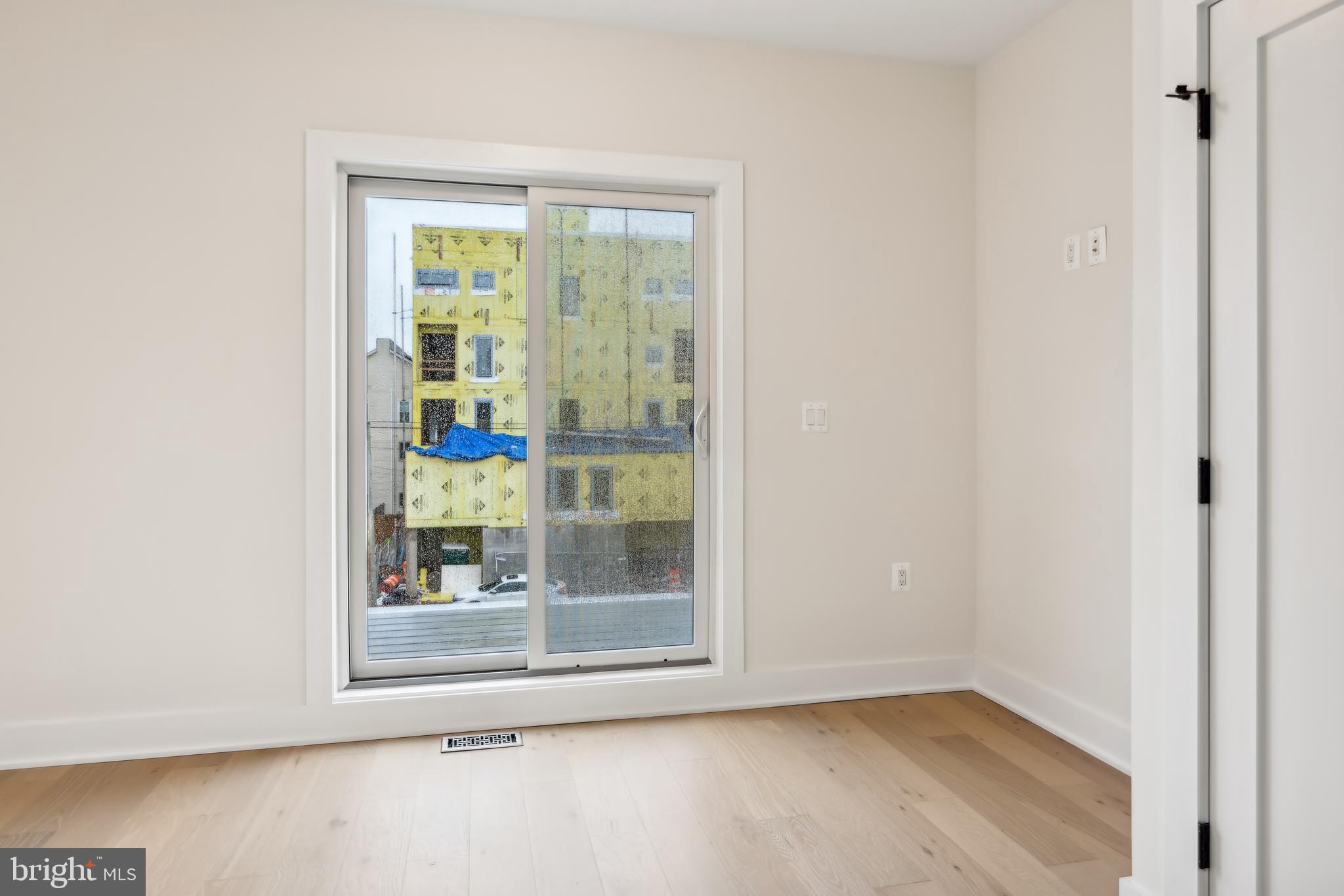 329 16th Street Southeast Washington, DC 20003 - Photo 26 of 39 a view of an empty room with wooden floor and a window